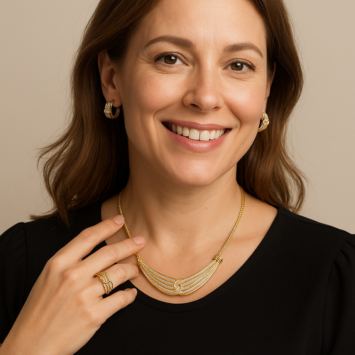 Woman wearing 14K gold-plated 3-piece diamond jewelry set with necklace, earrings, and ring totaling 2/5 carat diamonds